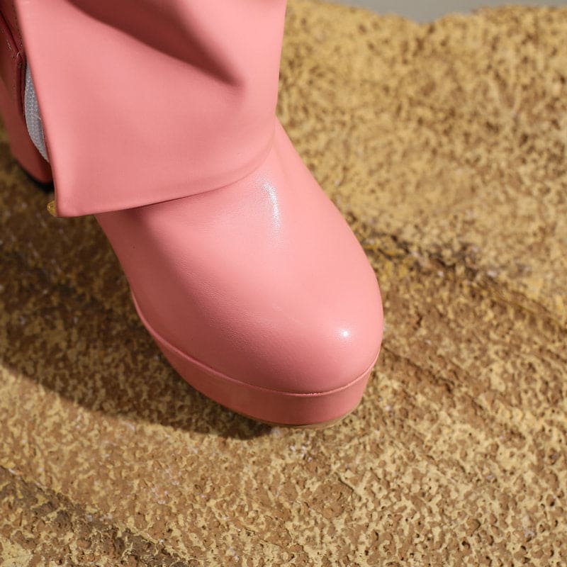 Pink patent leather platform shoe or boot.