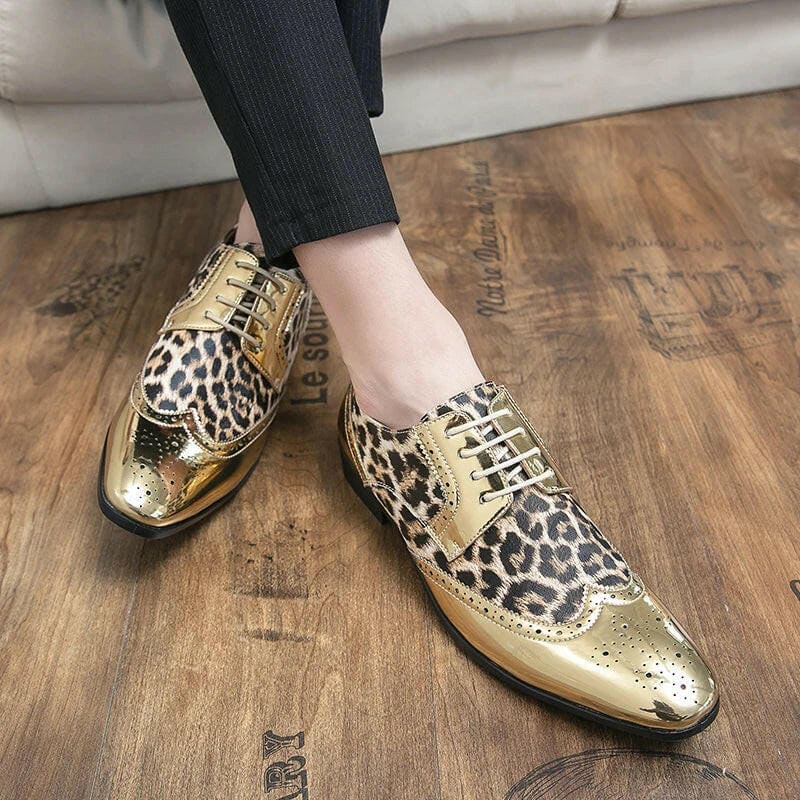 Pair of gold and leopard print wingtip oxford shoes.