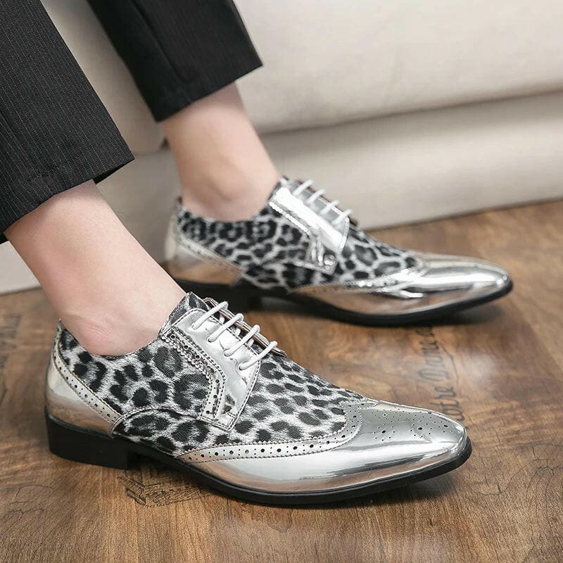 Stylish silver and leopard-print wingtip dress shoes.