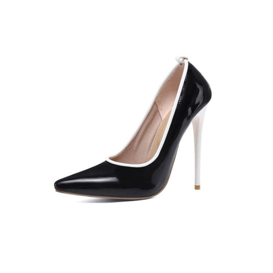 Black high-heeled pump with a white stiletto heel and pointed toe.