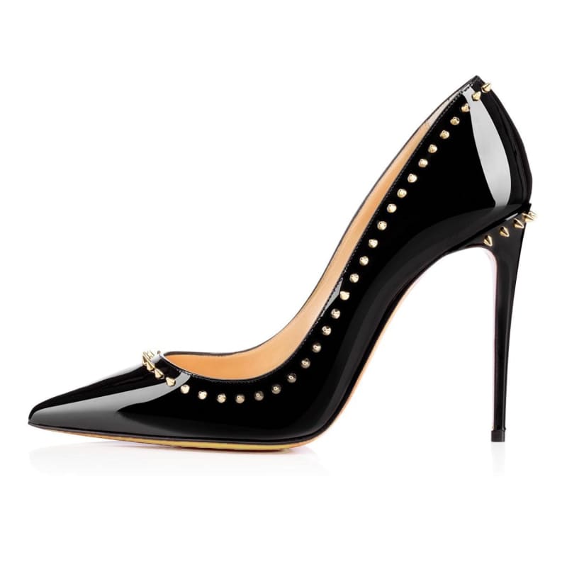 Black patent leather high heel pump with gold studs along the edges.
