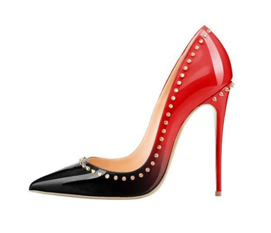 High-heeled stiletto shoe with a red and black gradient design, adorned with gold studs along the edges.