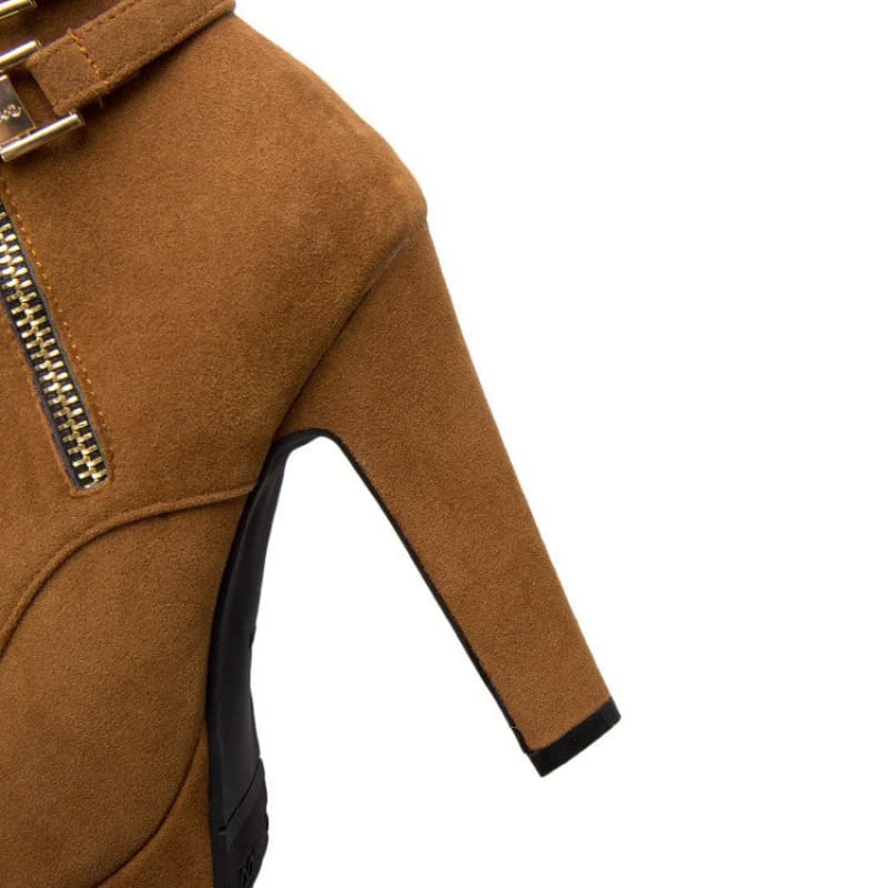 Tan suede high-heeled ankle boot with a side zipper.