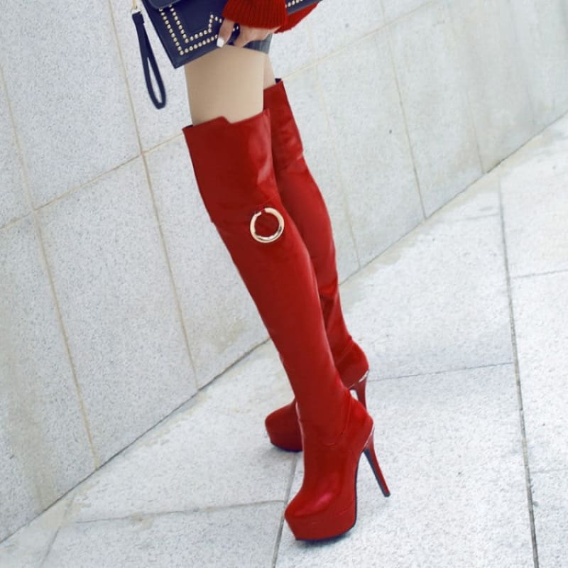 Bright red thigh-high stiletto boots with a platform sole.